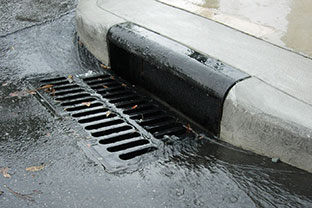 stormwater drain with rain water runoff